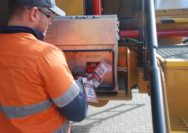 Total Fire Solutions team member installing a TFS fire panel onsite.